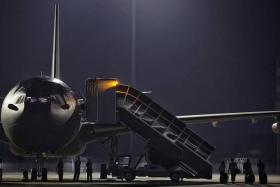 Some of the 69 SAF personnel deployed seen boarding the A330 Multi-Role Tanker Transport (MRTT) aircraft at Changi Air Base (East) on March 15, 2024. 
