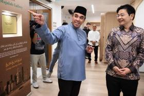 DPM Lawrence Wong (right) touring the Majulah Gallery at Khadijah Mosque with the mosque's chairman and Religious Rehabilitation Group co-chairman Mohamed Ali on April 1.