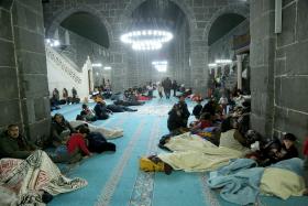 People take shelter at the historical Ulu Mosque following an earthquake, in Diyarbakir, Turkey.