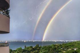 A double rainbow outside Mr Simon Lim's balcony at Neptune Court in Marine Parade, on April 21, 2023. 