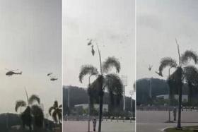 A video of the incident shows one of the helicopters clipping the rotor of the other aircraft before the two crash into the ground.