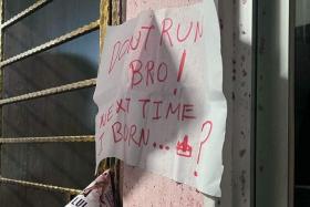 A note with the warning “Don’t run bro... next time I burn” was stuck on the wall next to the gate.