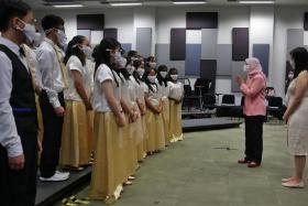 President Halimah Yacob visiting the choir during a recording session at Nee Soon Camp on June 7, 2022.
