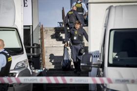 Police collect evidence on the site of the Fields shopping mall in Copenhagen on July 4, 2022.