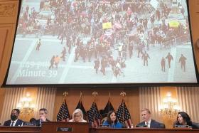 An image of US Capitol rioters at the July 21 public hearing of the House committee investigating the Jan 6 attack.