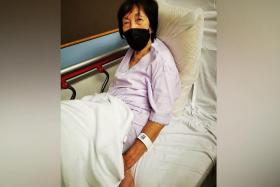 Madam Lim had been about to alight from the SBS Transit bus when the door suddenly closed and hit her on the shoulder, causing her to fall.