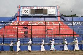 Hindus take part in a ritual to pray for the victims at Kanjuruhan Stadium in Malang on Oct 7, 2022.
