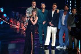 US singer-songwriter Taylor Swift accepts the award for Best Pop Video, presented by NSync members (from left) Joey Fatone, Lance Bass, Justin Timberlake, JC Chasez and Chris Kirkpatrick, onstage during the MTV Video Music Awards at the Prudential Center in Newark, New Jersey, on Sept 12, 2023.