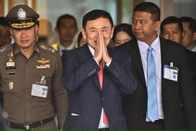 Former Thai premier Thaksin Shinawatra (centre) at Don Mueang airport in Bangkok, Thailand, on Aug 22. 