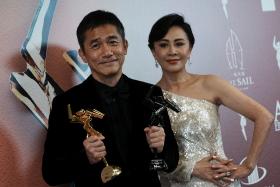 Actor Tony Leung his wife Carina Lauat the 16th Asian Film awards in Hong Kong on March 12, 2023.