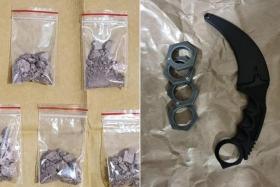 Drugs, including heroin, were seized from a flat in Redhill while knuckle dusters and a karambit knife were taken from a unit in Pasir Ris.