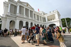 Visitors queueing to enter the Istana Main Building on Nov 12, 2023.
