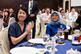 President Halimah Yacob (right) and YMCA chief executive Wu Mei Ling at a gala dinner where the $163,000 was raised.