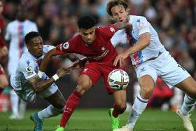Liverpool's Luis Diaz (centre) fights for the ball with Crystal Palace's Nathaniel Clyne (left) and Joachim Andersen, on Aug 15, 2022.