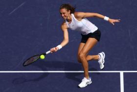 Petra Martic plays a forehand volley against Emma Raducanu in their third round match, on March 13, 2022.