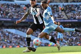 Newcastle United&#039;s Jamaal Lascelles (left) vies with Manchester City&#039;s Raheem Sterling, on May 8, 2022.